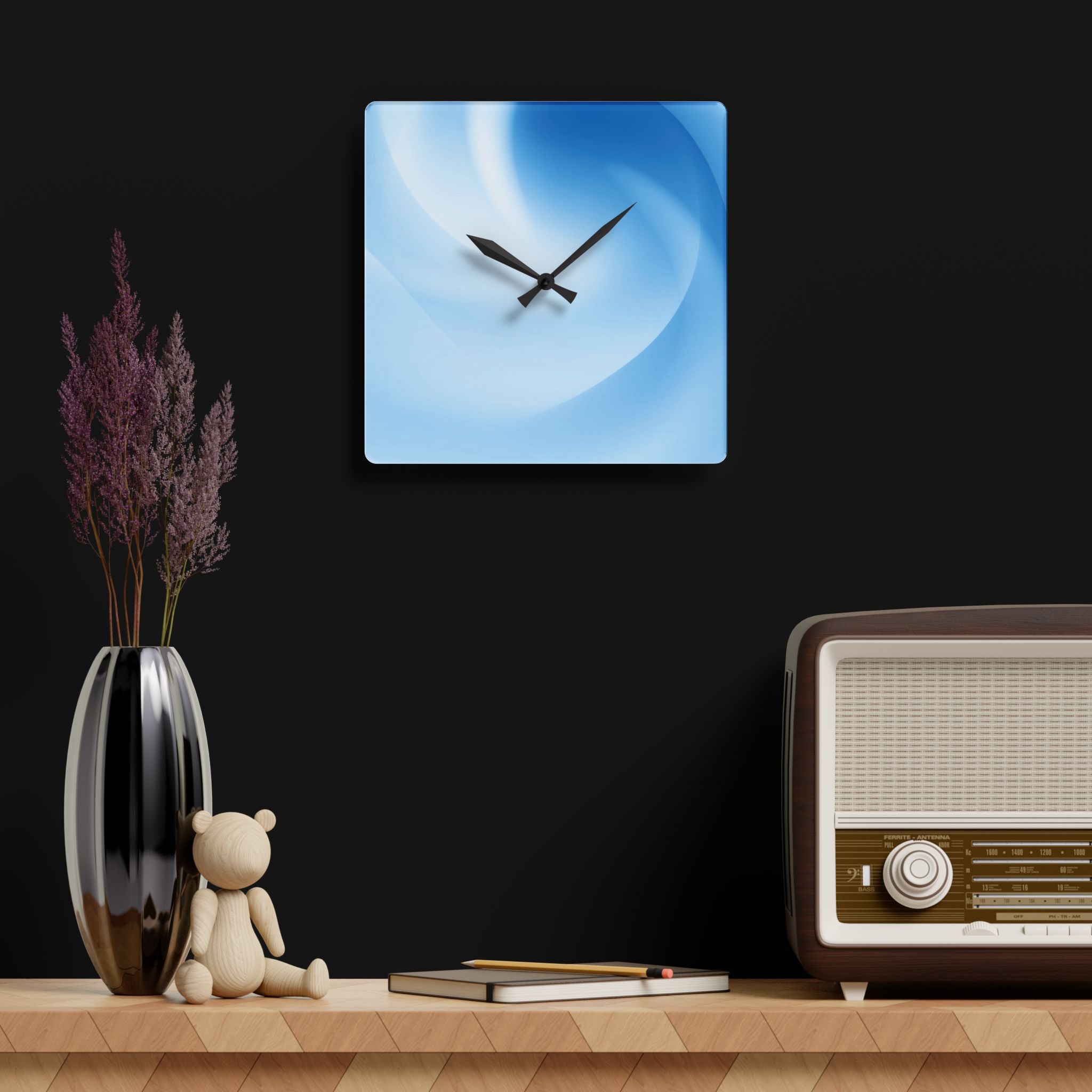 “Atlas Veil” acrylic wall clock by HOUR1207 displayed against dark studio-style walls, featuring soft blue abstract gradients, glossy acrylic finish, and a futuristic atmospheric presence.