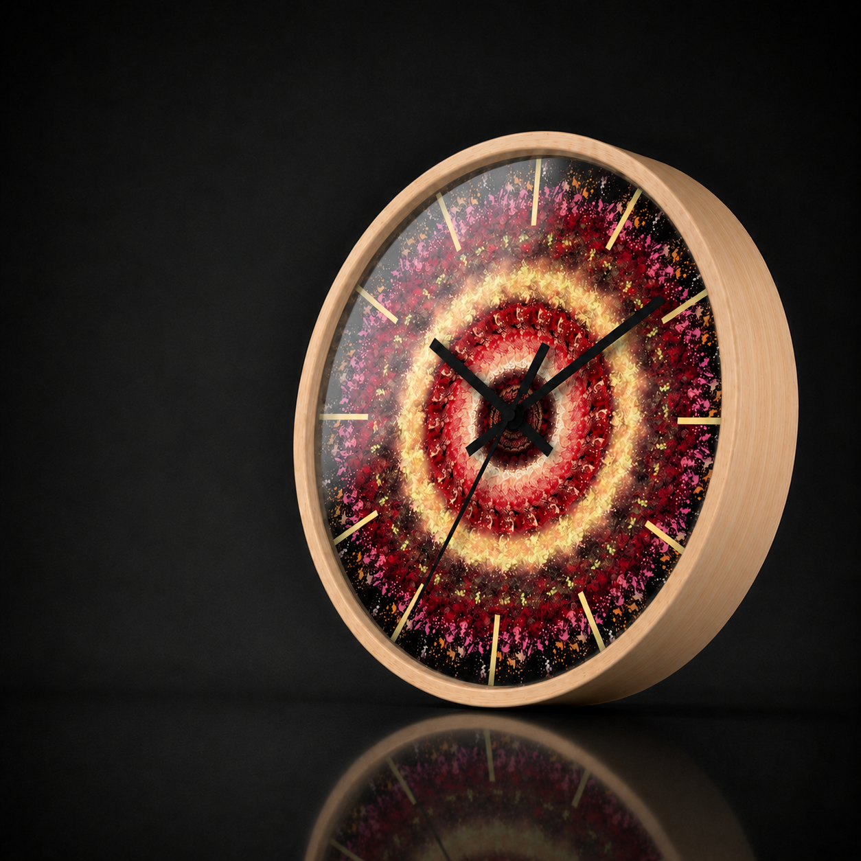 Seraphine round wall clock with a natural wood frame and vibrant red, pink and golden mandala artwork, presented in a dark premium studio setting with a soft acrylic reflection and subtle mirrored surface